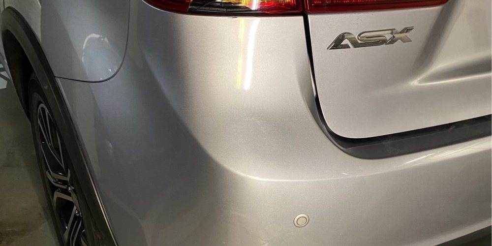 Nissan ASX rear quarter dent: drag to compare (after paintless repair)