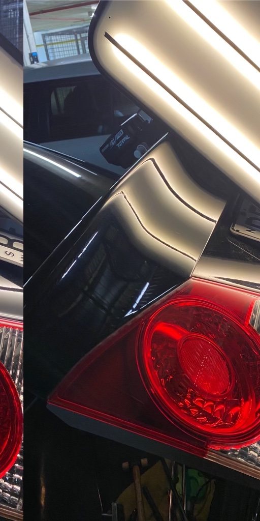 Red tail-light panel dent (after paintless repair)